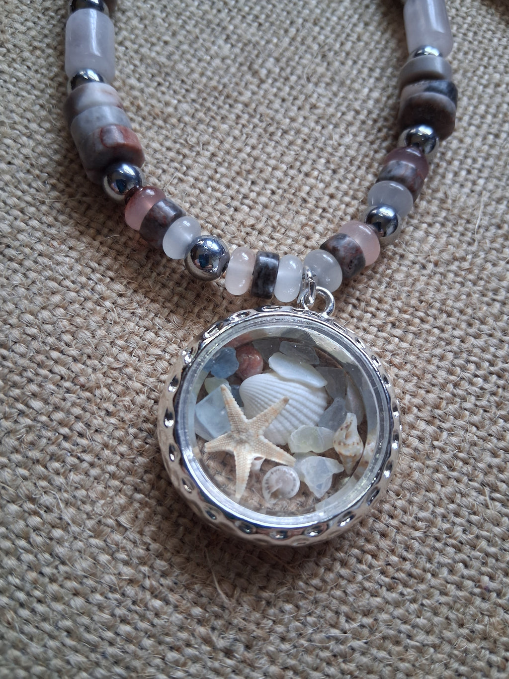 Morning Treasure glass locket pendant with starfish and shells