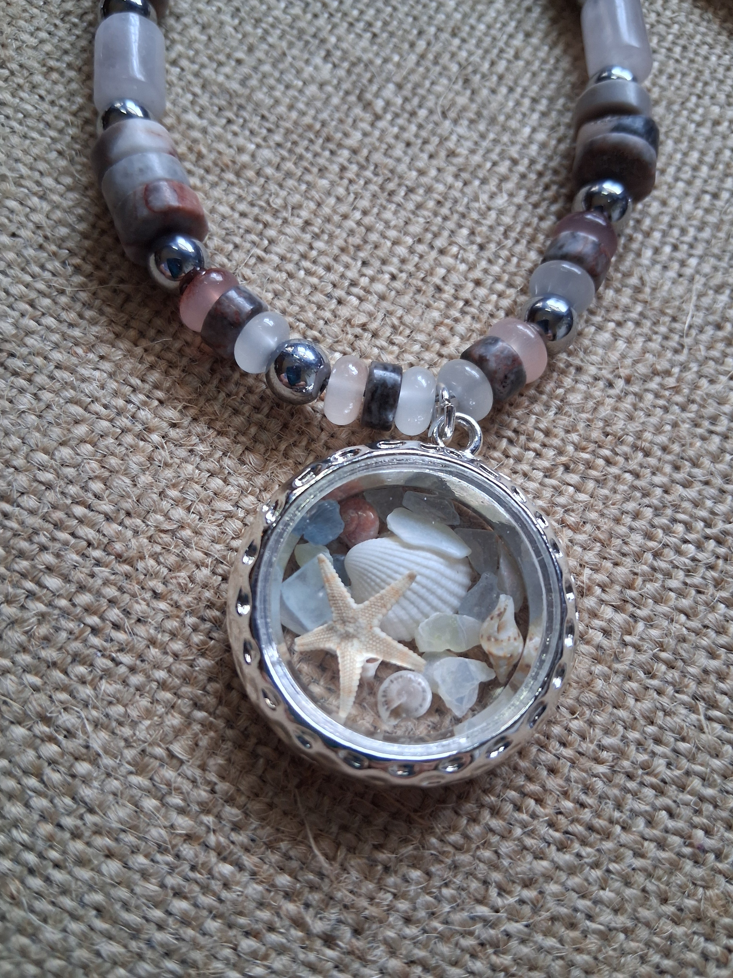 Morning Treasure glass locket pendant with starfish and shells