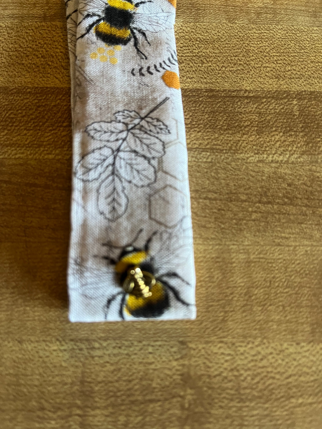 Bee Still fabric wrist cuff detail view
