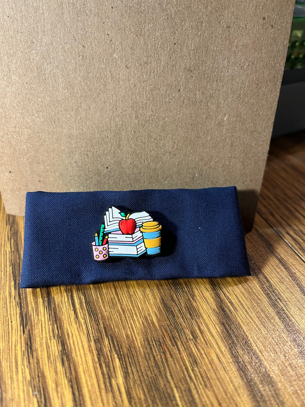 Hittin' the Books navy wrist wrap folded showing books charm