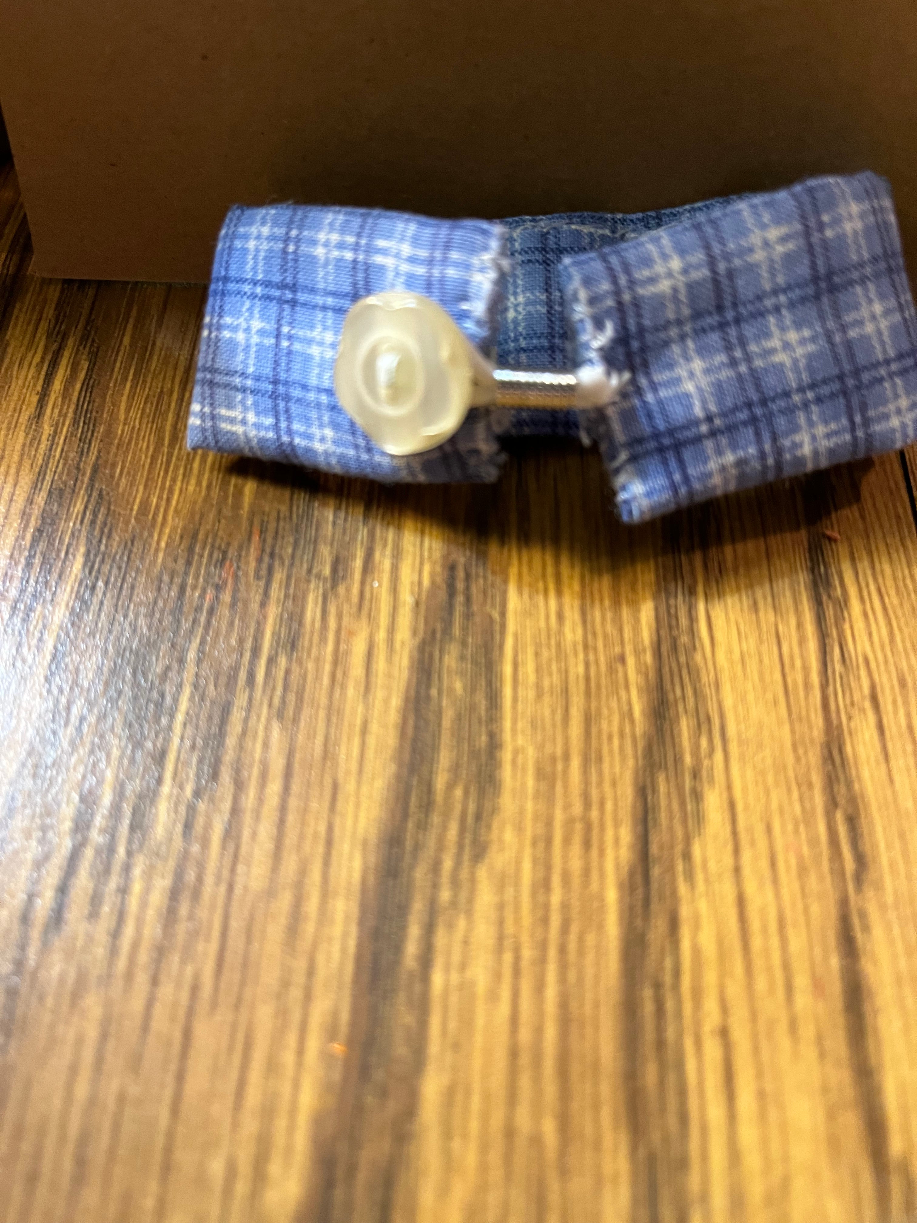 Gingham Door blue plaid wrist wrap folded showing cream rose button