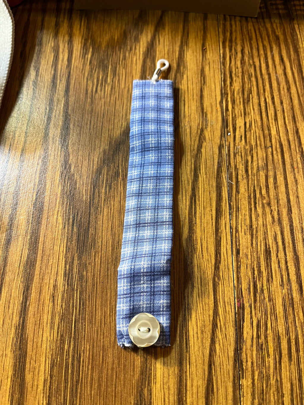 Gingham Door blue plaid wrist wrap full length showing white lobster clasp
