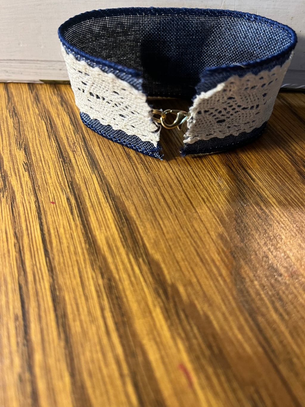 Time Well Spent navy denim and lace wrist wrap close-up showing silver lobster clasp closure