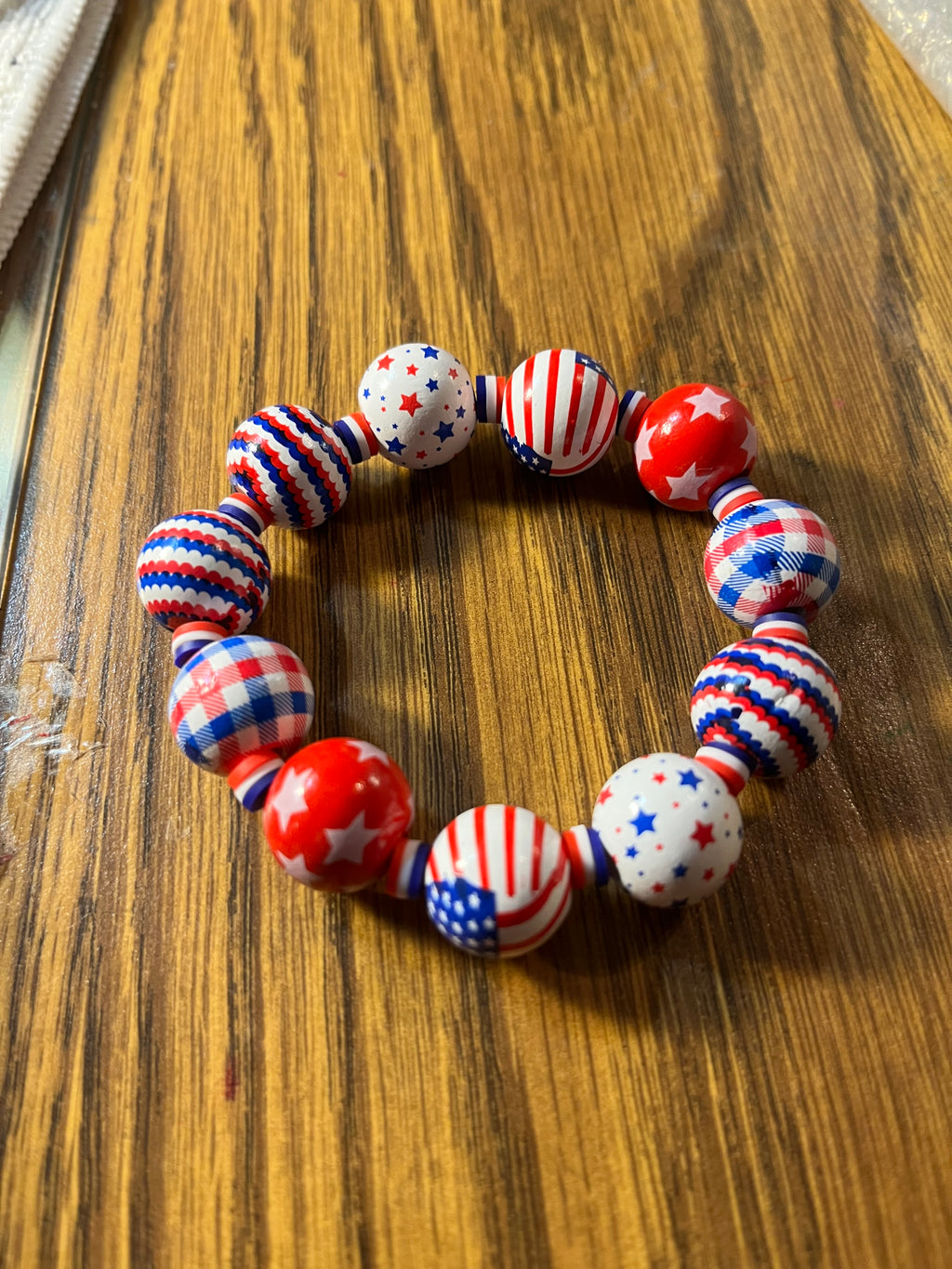 All American patriotic chunky bead stretch bracelet on wood surface