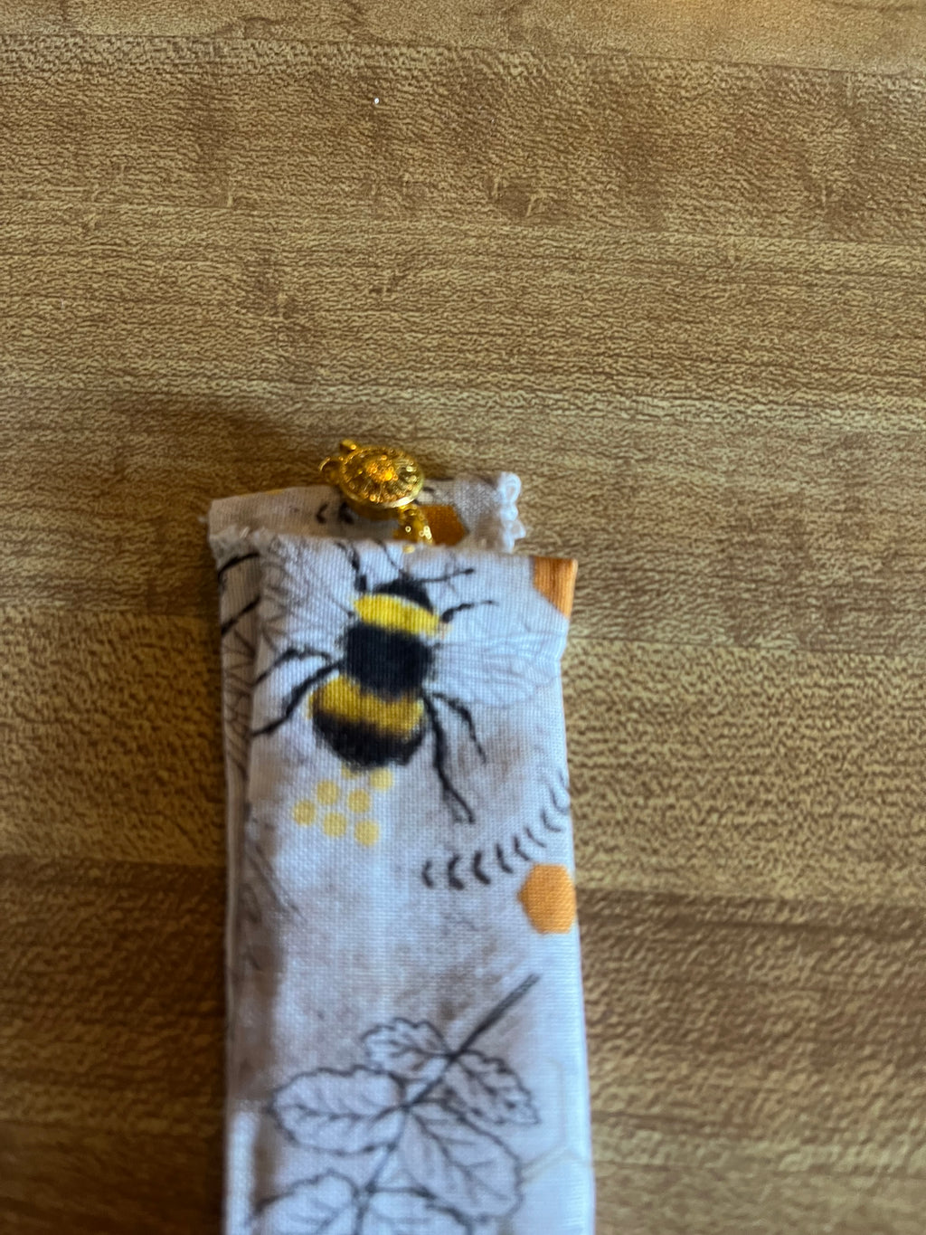 Bee Still fabric wrist cuff top view