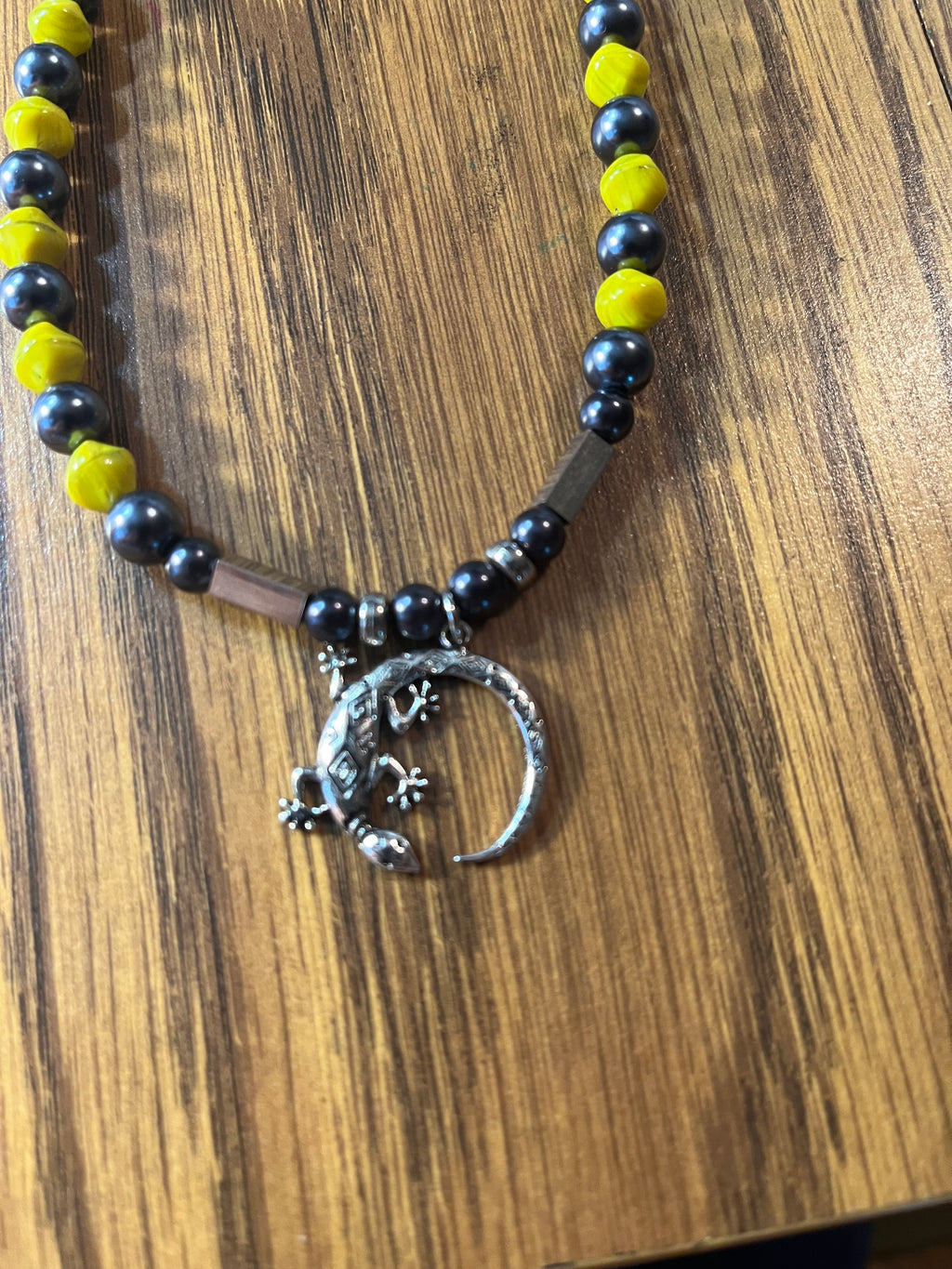 South Carolina Sallie necklace close-up showing silver gecko lizard on crescent moon pendant