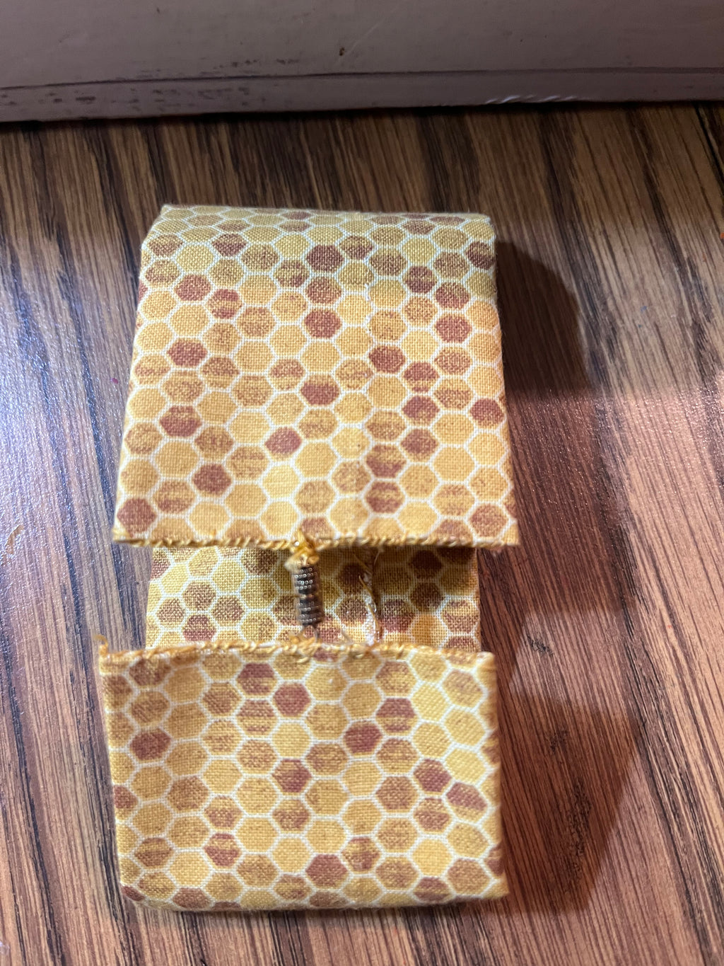 Queen Bee fabric wrist cuff flat view
