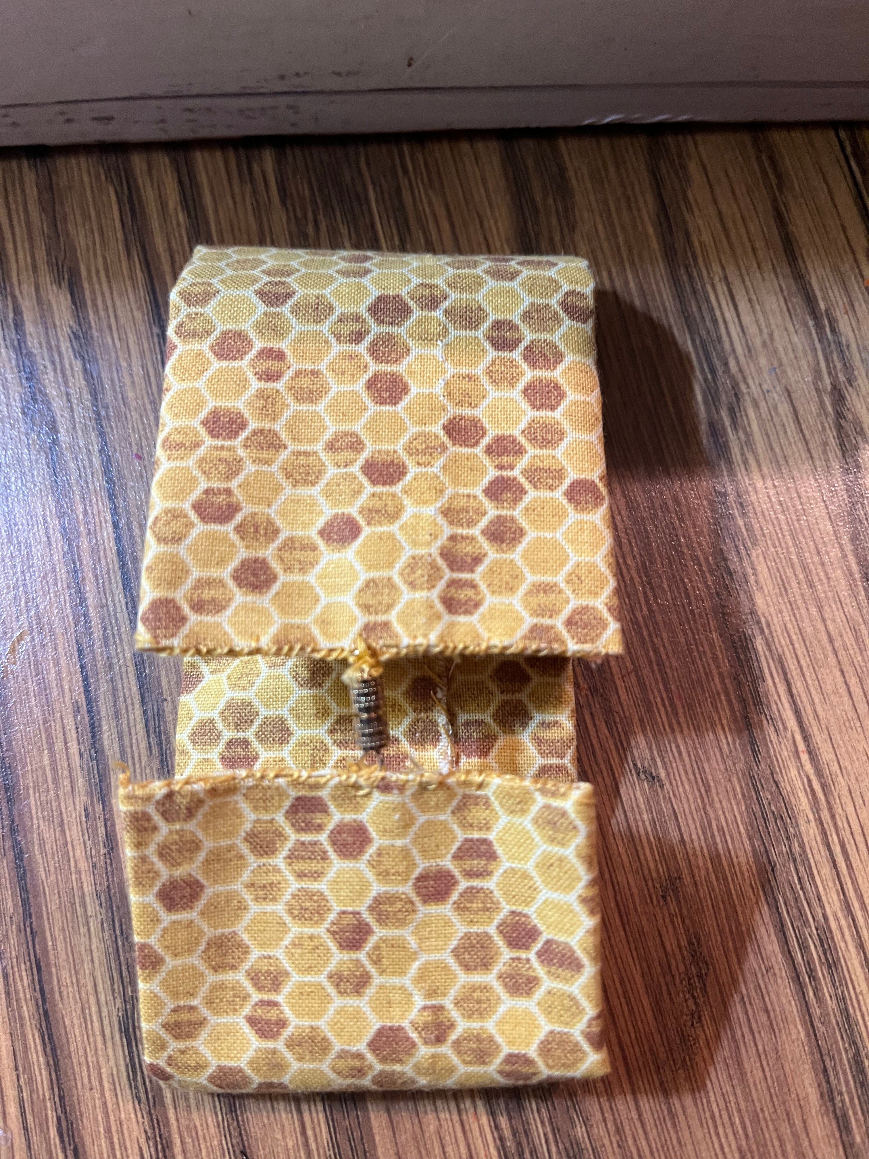 Queen Bee fabric wrist cuff flat view
